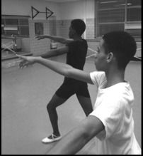 young men dancing in ballet class.
