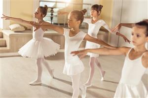Girls dancing in ballet class.